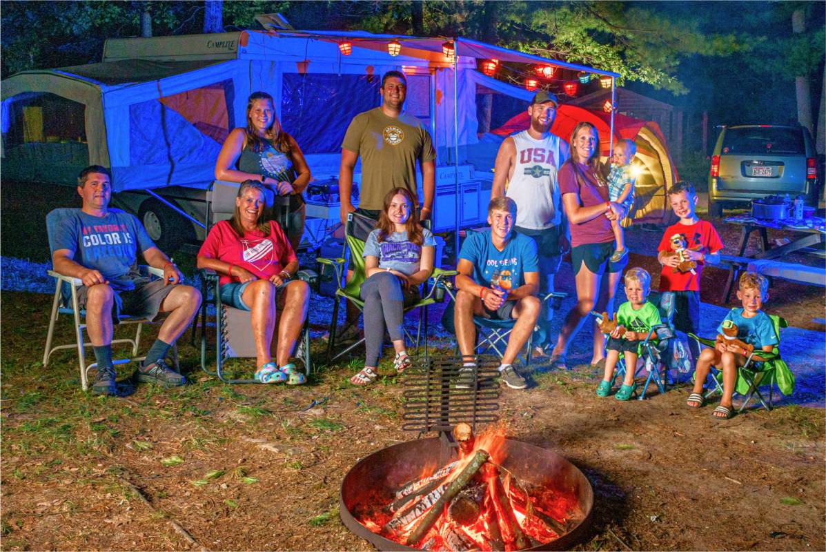 Family around campfire